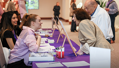 Mesulam Center staff members greet attendees at Alzheimer Day