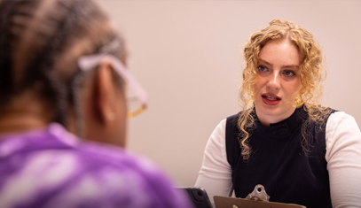 A Mesulam Center staff member meets with a participant